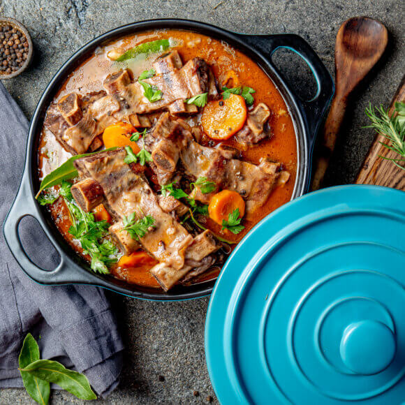 Beef ribs Bourguignon. Beef ribs stewed with carrot, onion in red wine. France dish. Top view