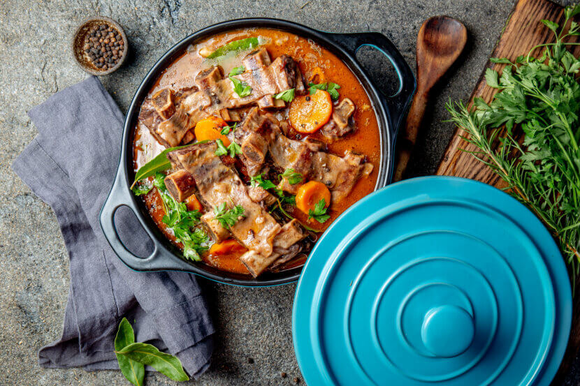 Beef ribs Bourguignon. Beef ribs stewed with carrot, onion in red wine. France dish. Top view