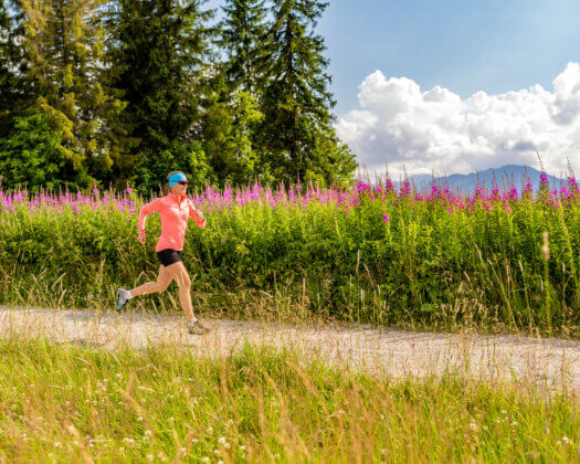 Woman athlete trail running in mountains, sport and fitness