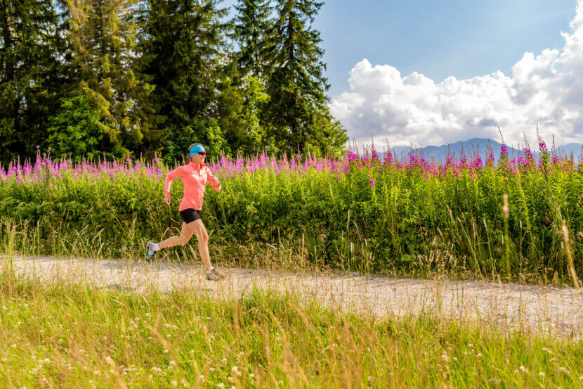 Woman athlete trail running in mountains, sport and fitness
